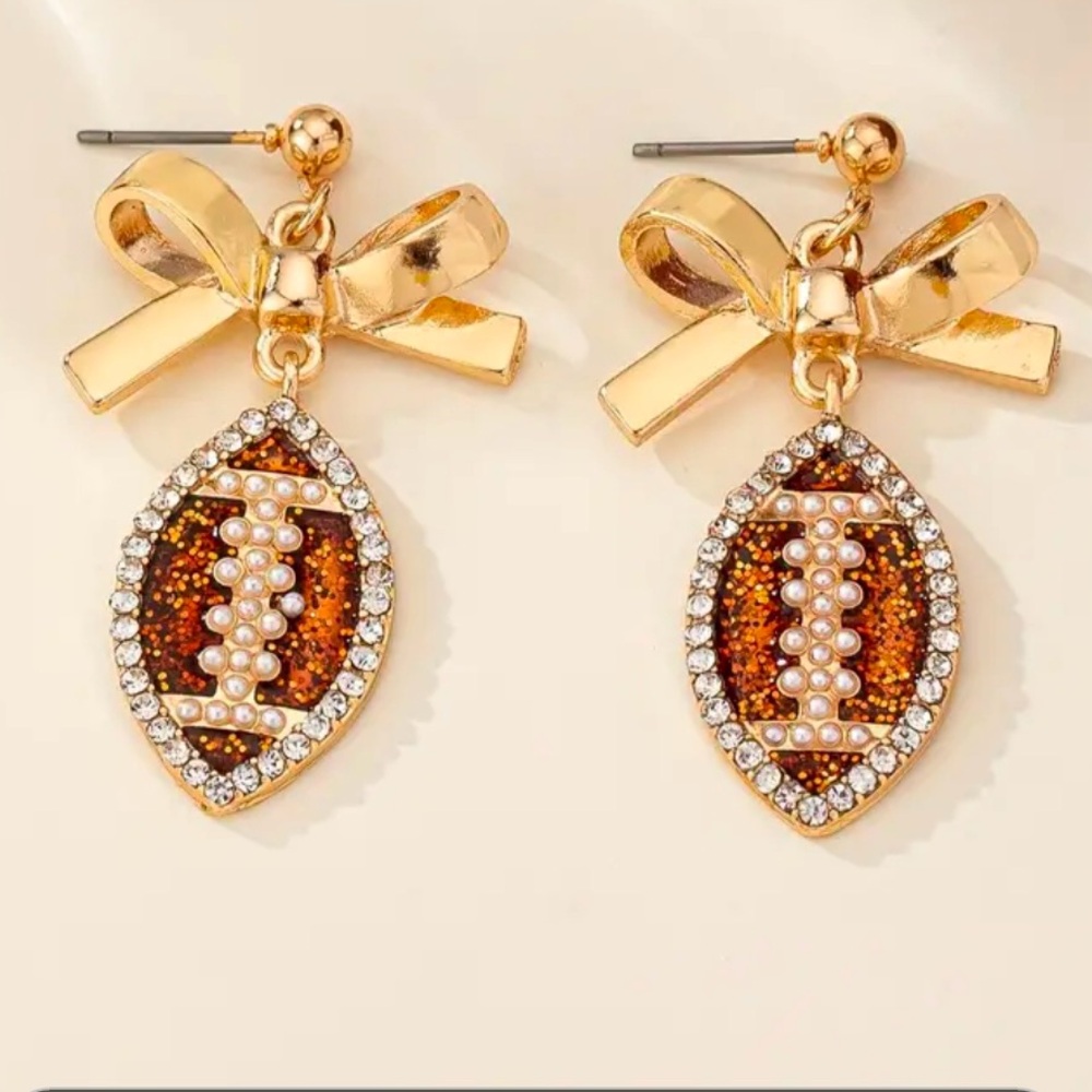 New Stock Football dangle earrings. Embellished with rhinestones and faux pearls